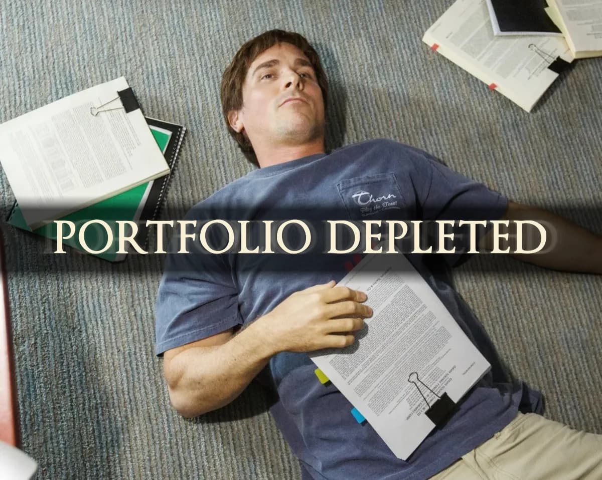 Dark Souls text effect example reading Portfolio Depleted over a photo of a man lying on the floor surrounded by financial documents