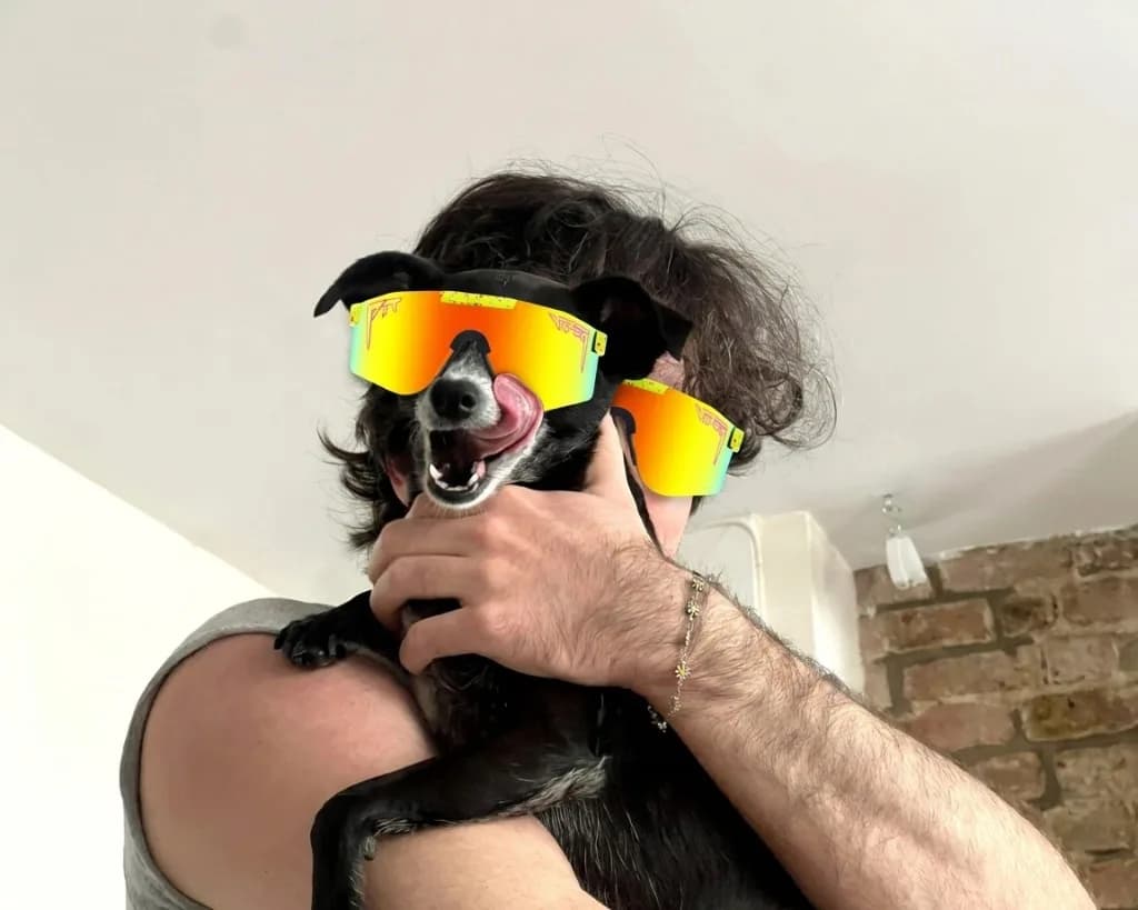 Guy and his dog both wearing matching 1993 Pit Vipers — multi-subject example